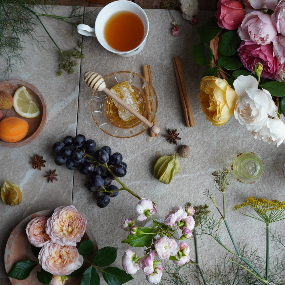Flatlay image of fragrance notes found in English roses bred by David Austin Roses.