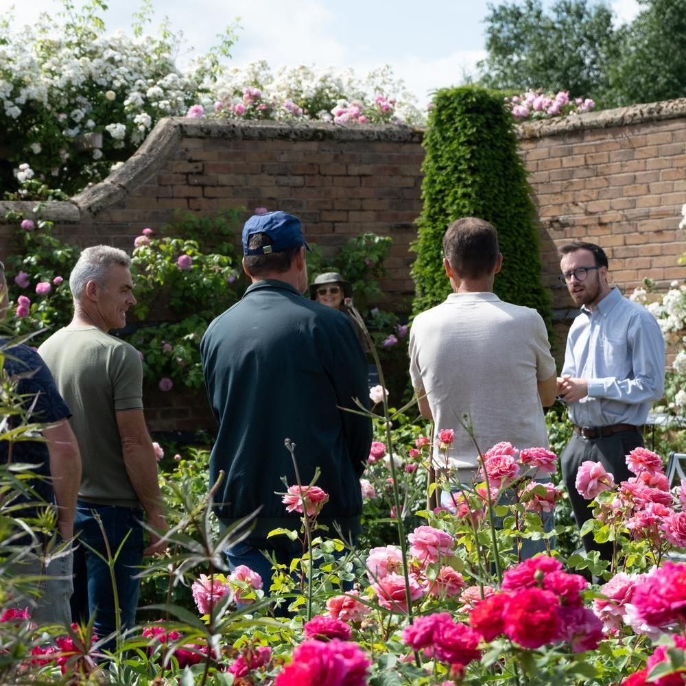 David Austin employee leading a group visit in the rose gardens
