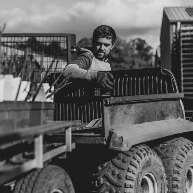 Man driving farm equipment